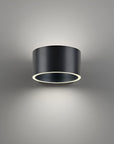 Black cylindrical light fixture on a gray background