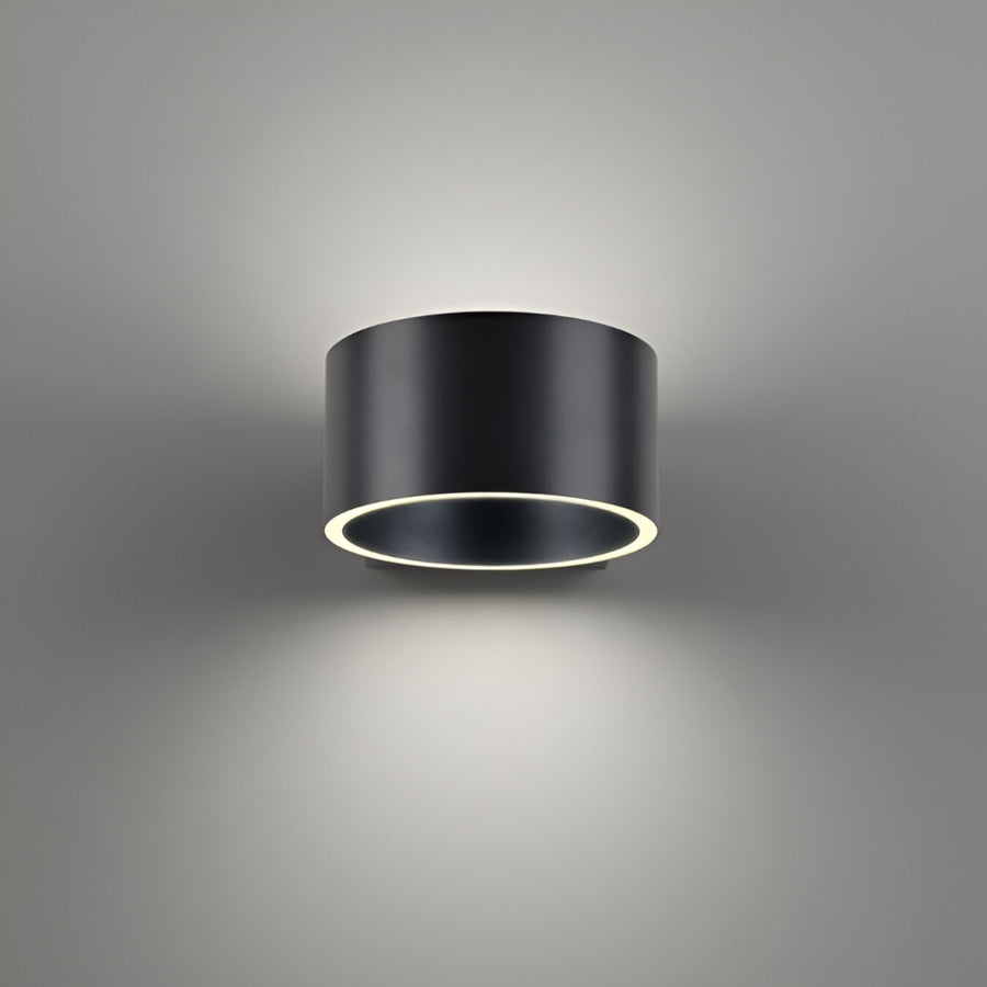 Black cylindrical light fixture on a gray background