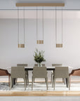 Modern dining room with a table and chairs under pendant lights.
