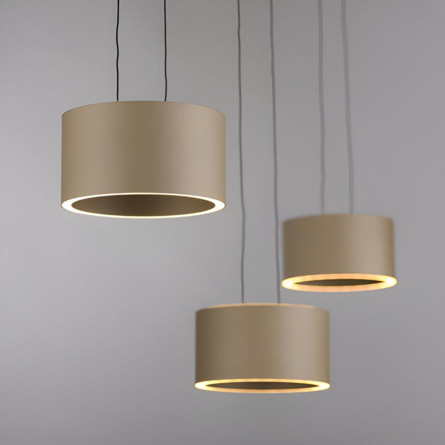 Three beige pendant lights hanging against a gray background