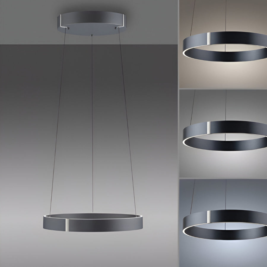 Modern kinetic pendant light showing different colour temperatures on a gray background