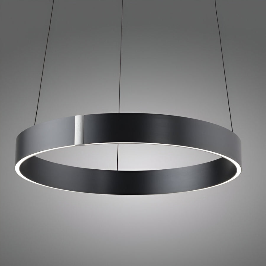 Modern pendant light with a black circular design on a gray background