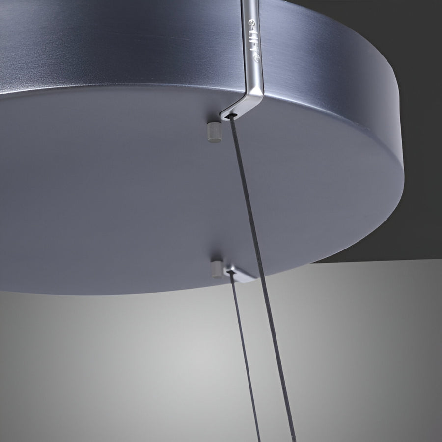 Close-up of a modern ceiling light fixture with a dark gray finish.
