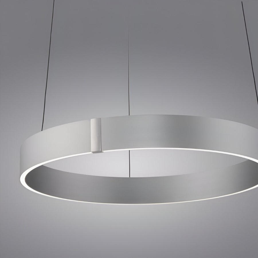 Modern pendant kinetic light with a circular design on a gray background