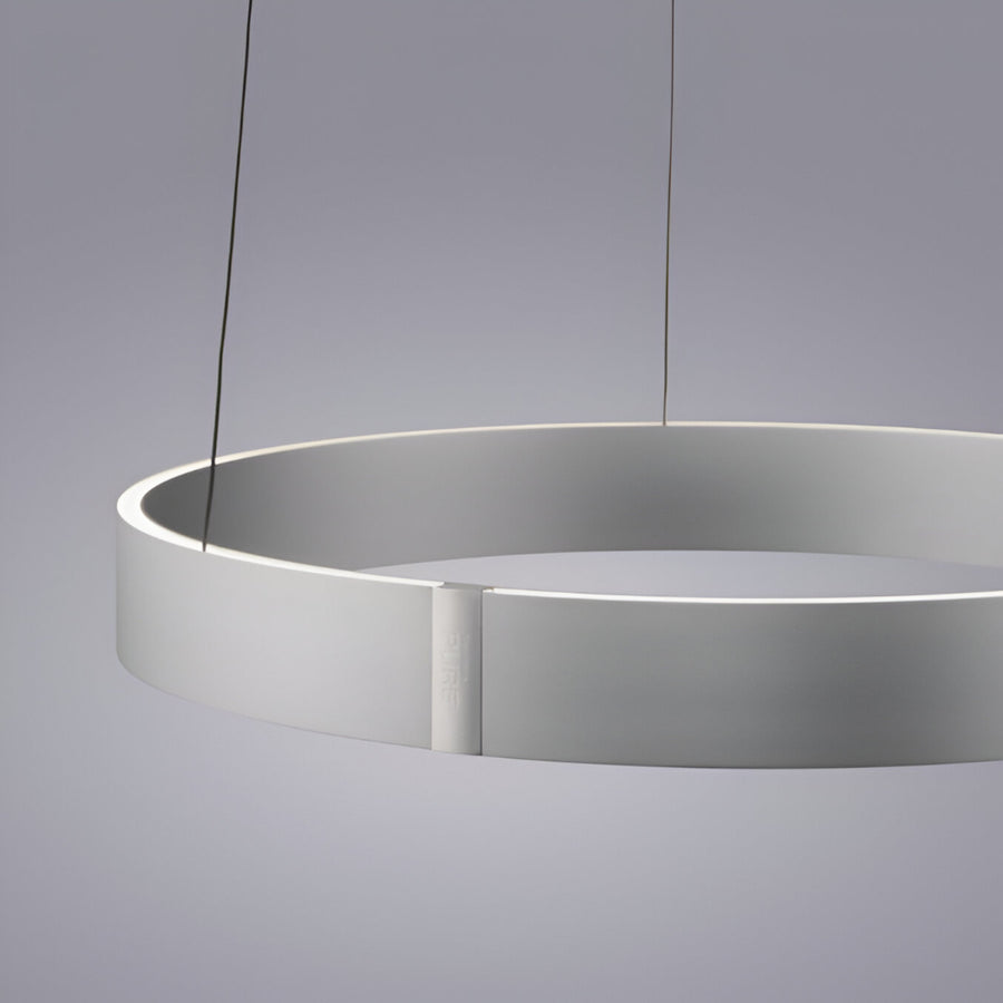 Modern pendant kinetic light with a minimalist design on a gray background