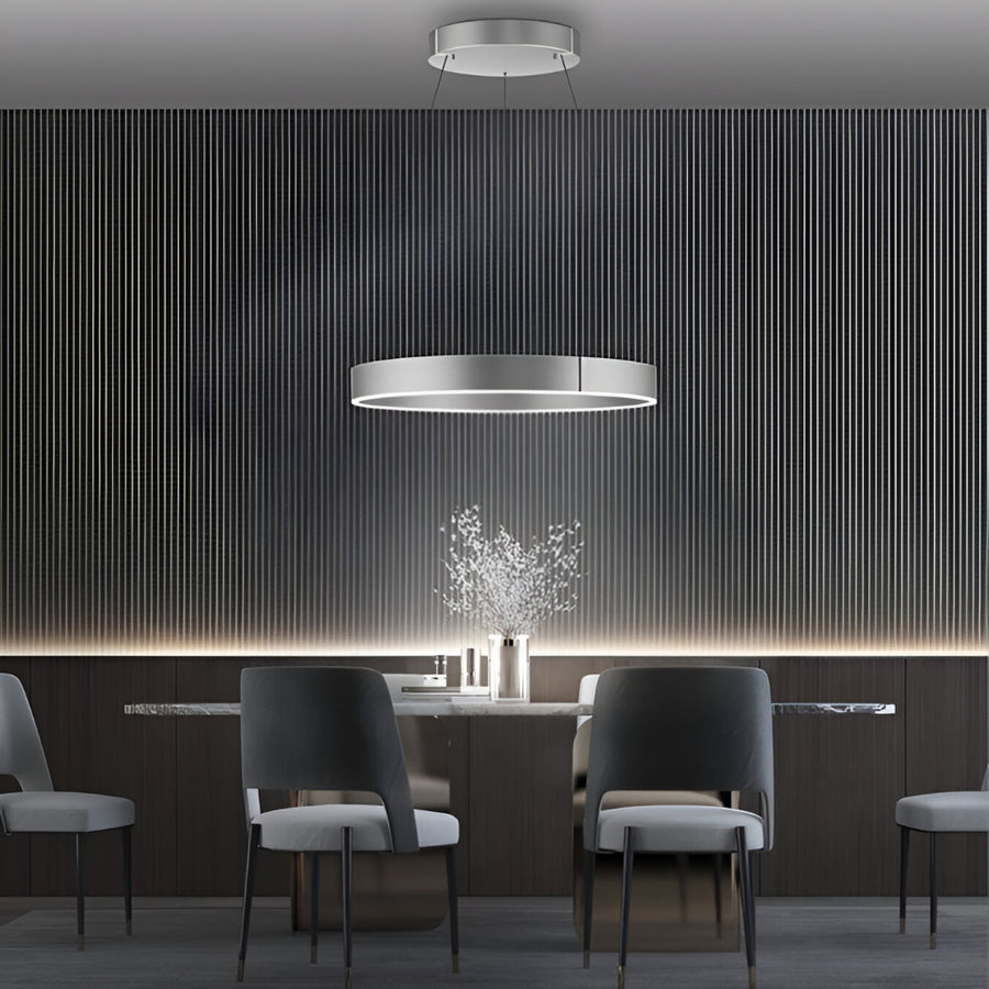 Modern dining room with gray chairs and a stylish kinetic chandelier.