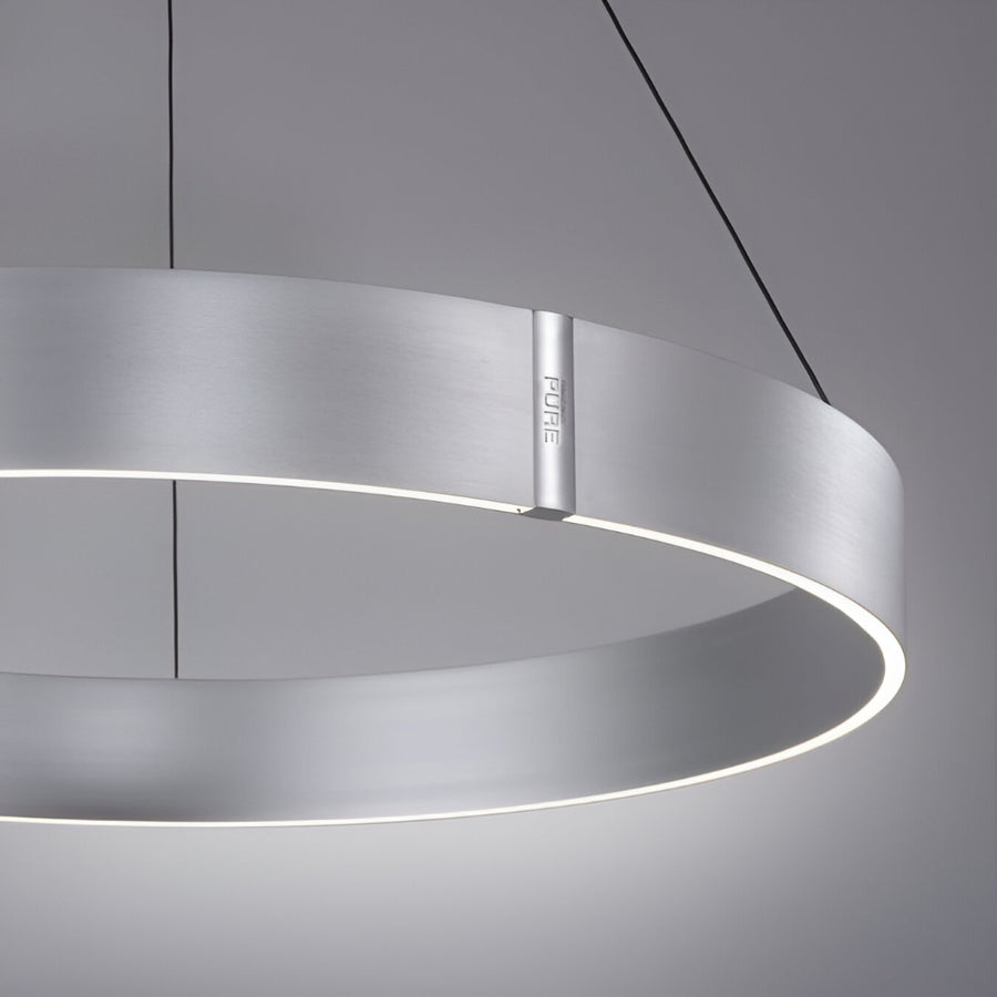 Modern circular kinetic chandelier on a gray background