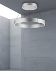 Modern kinetic pendant chandelier in a gray room