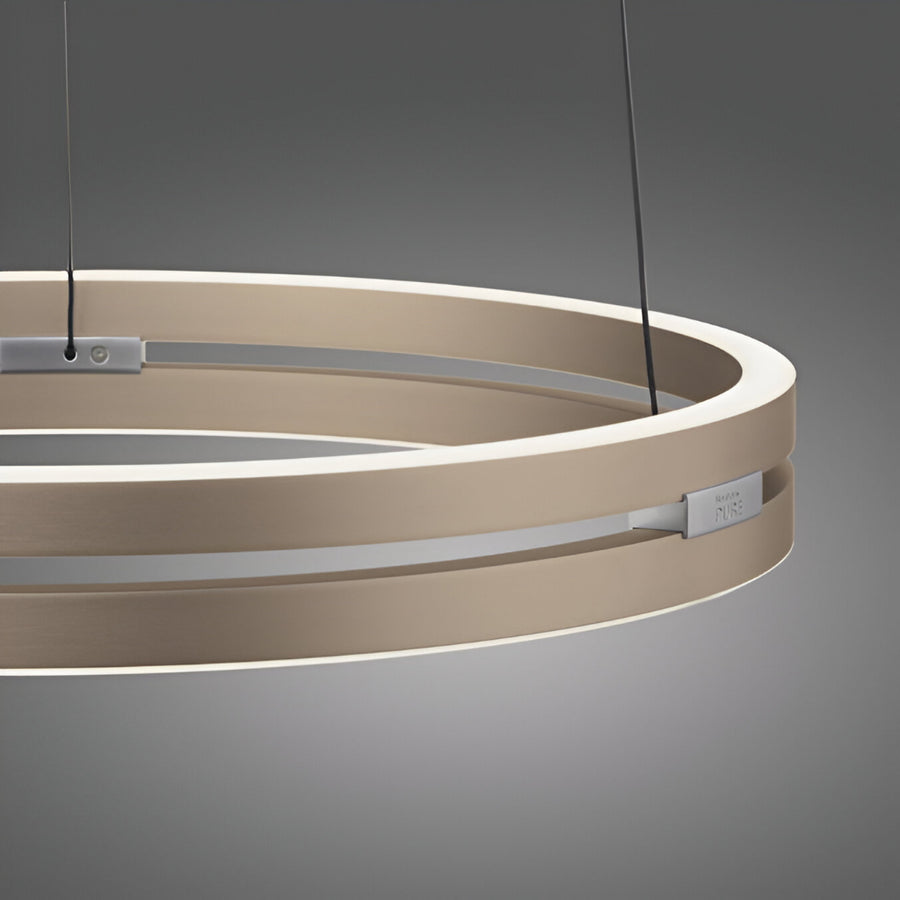 Modern pendant kinetic light with circular design on a gray background