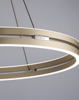 Modern kinetic chandelier with circular design on a gray background