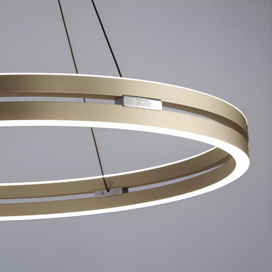 Modern kinetic chandelier with circular design on a gray background