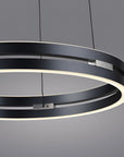 Modern black kinetic chandelier with circular design on a gray background