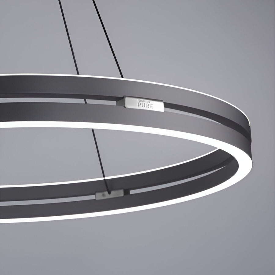 Modern pendant kinetic light with circular design on a gray background