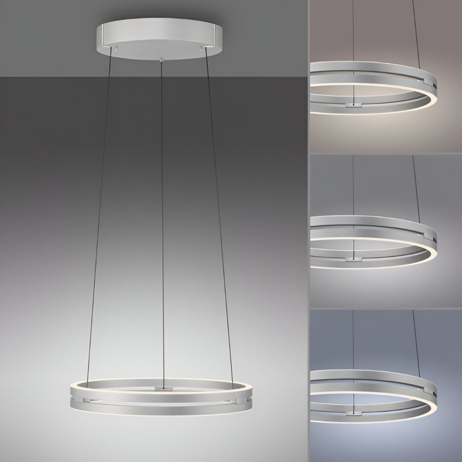 Modern kinetic pendant light with three circular rings on a gray background