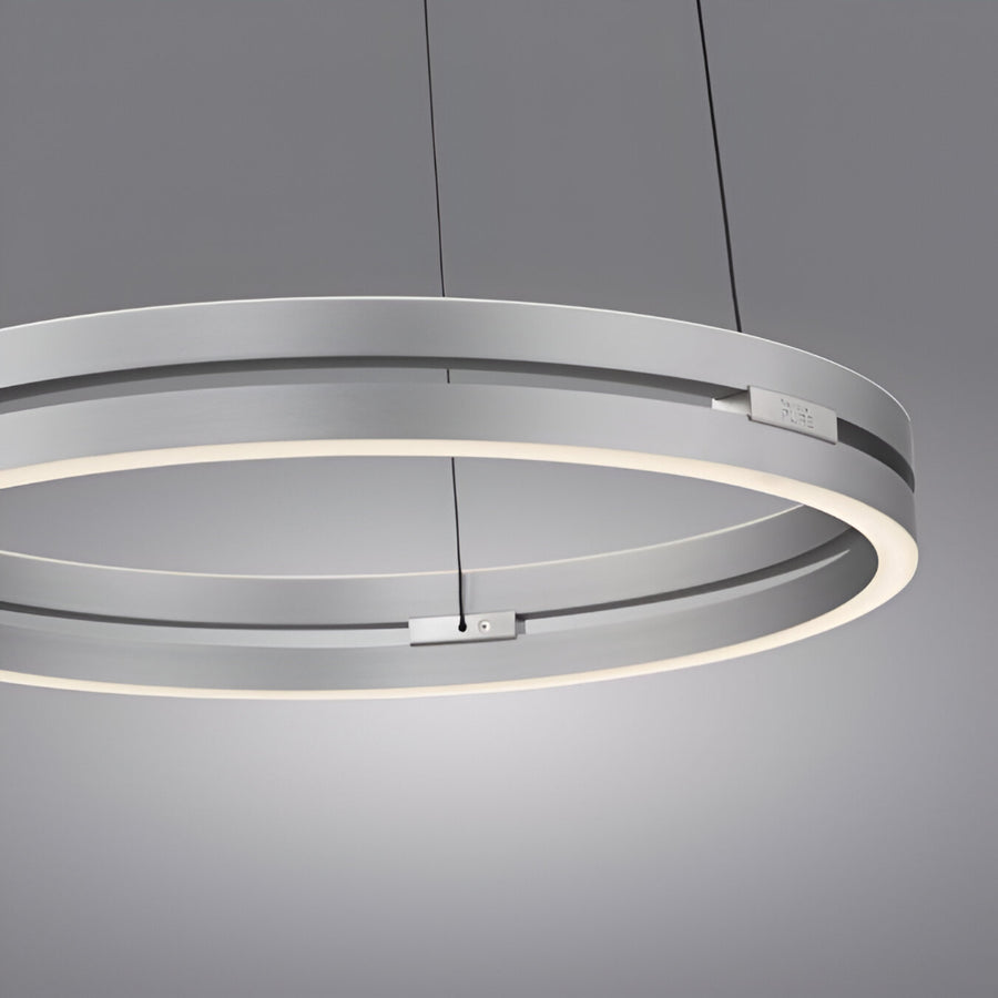 Modern Kinetic ring light fixture on a gray background