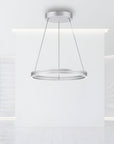 Modern pendant kinetic light fixture hanging from the ceiling in a minimalistic interior.