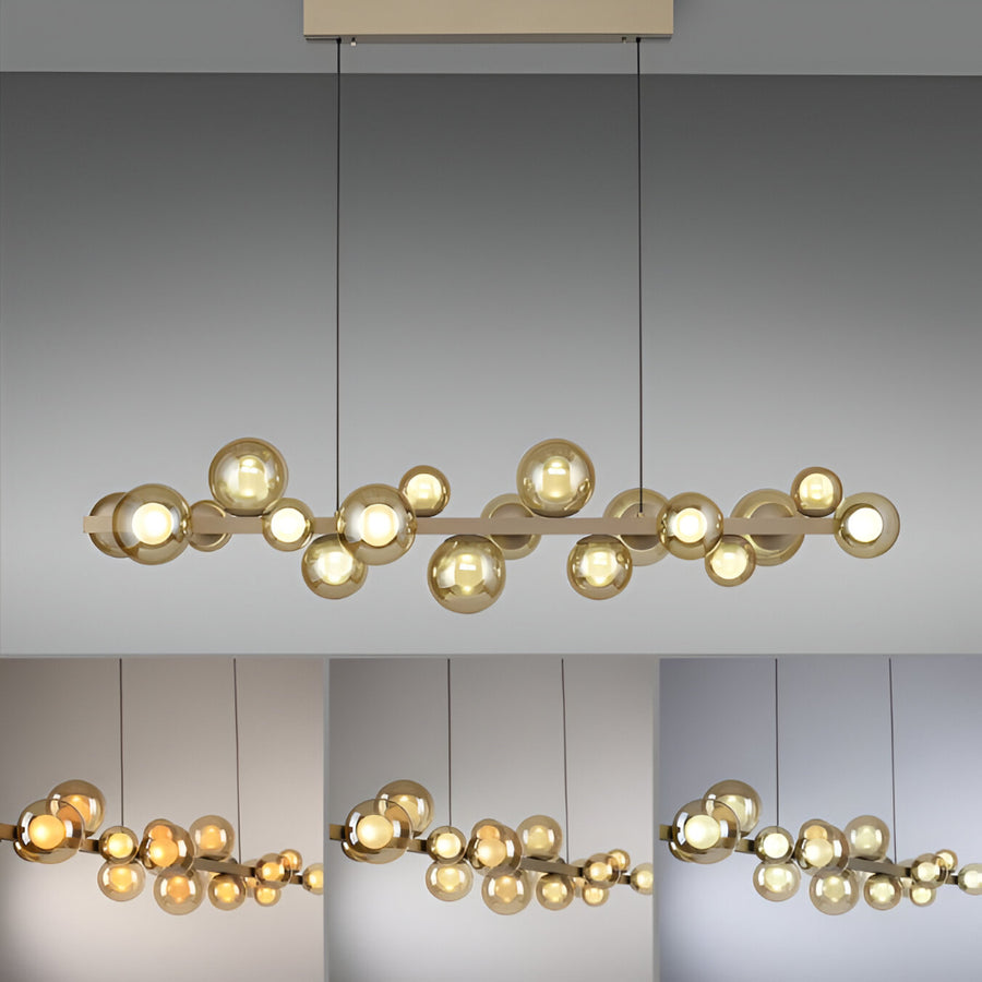 Modern kinetic chandelier with gold bulbs on a gray background showing different colour temperatures
