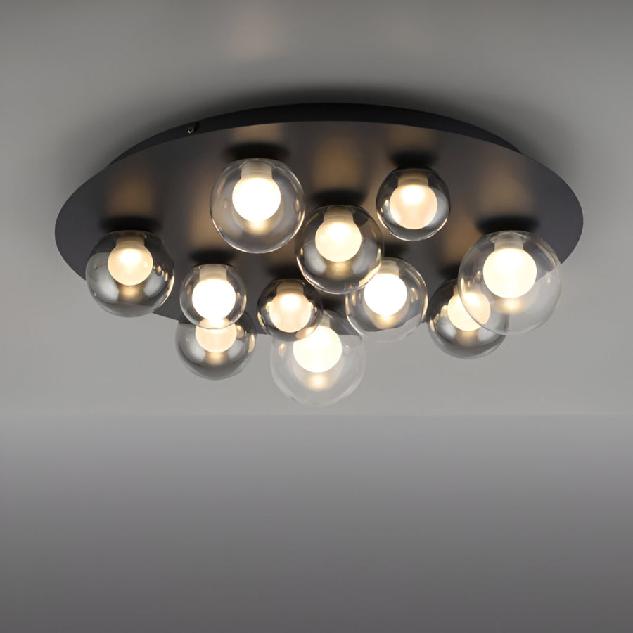 Modern ceiling light fixture with multiple glass bulbs on a gray background