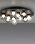 Modern ceiling light fixture with multiple bulbs on a gray background