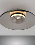 Round ceiling light fixture on a gray background