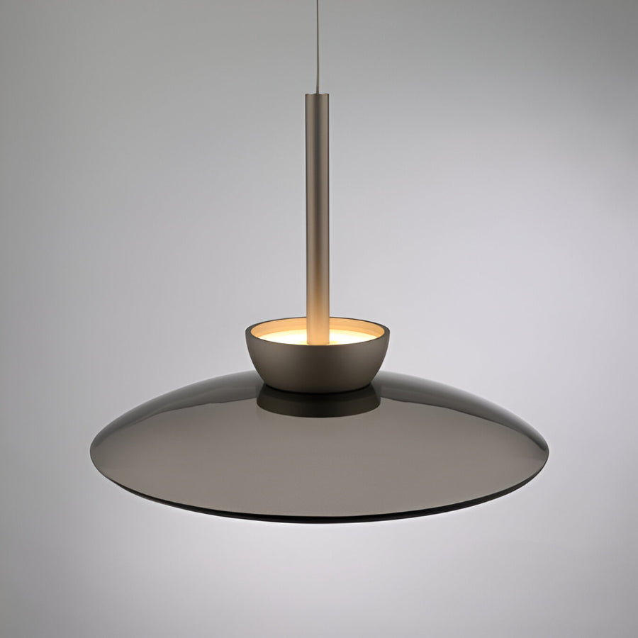 Modern pendant light with a dark glass shade on a gray background