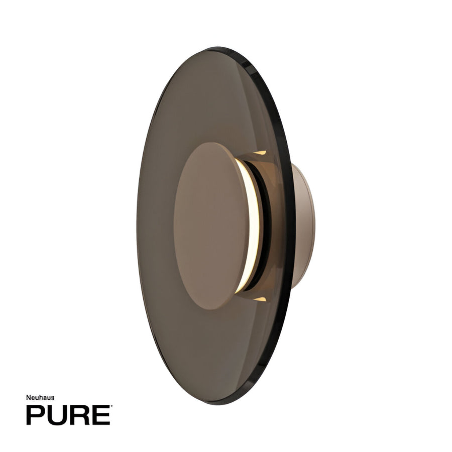 Round wall sconce with reflective surface on a white background, branded 'Neuhaus Pure'.