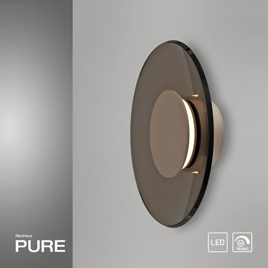 Modern wall light fixture with 'Neuhaus PURE' branding on a gray background