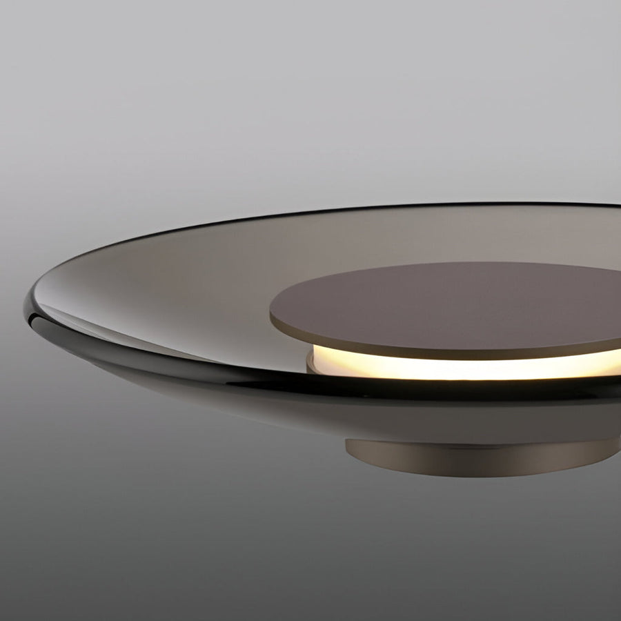 Modern glass table lamp on a gray background