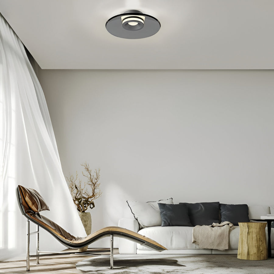 Modern living room with a chaise lounge, sofa, and decorative elements.