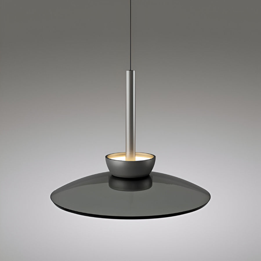 Modern adjustable height pendant light with a dark base and metallic fixture on a gray background