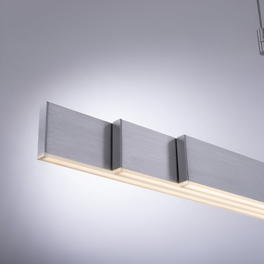 Modern ceiling light fixture with three rectangular panels on a gray background