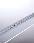 Close-up of a metallic kinetic track with buttons on a white background