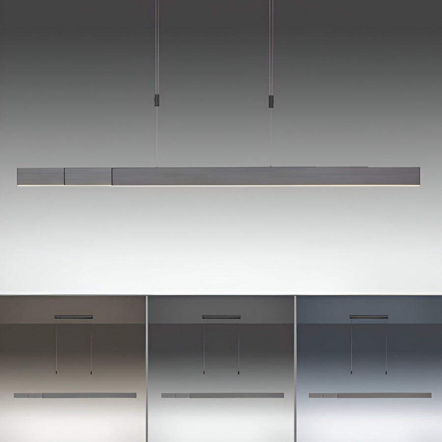 Modern pendant kinetic light fixture on a neutral background showing various light temperatures