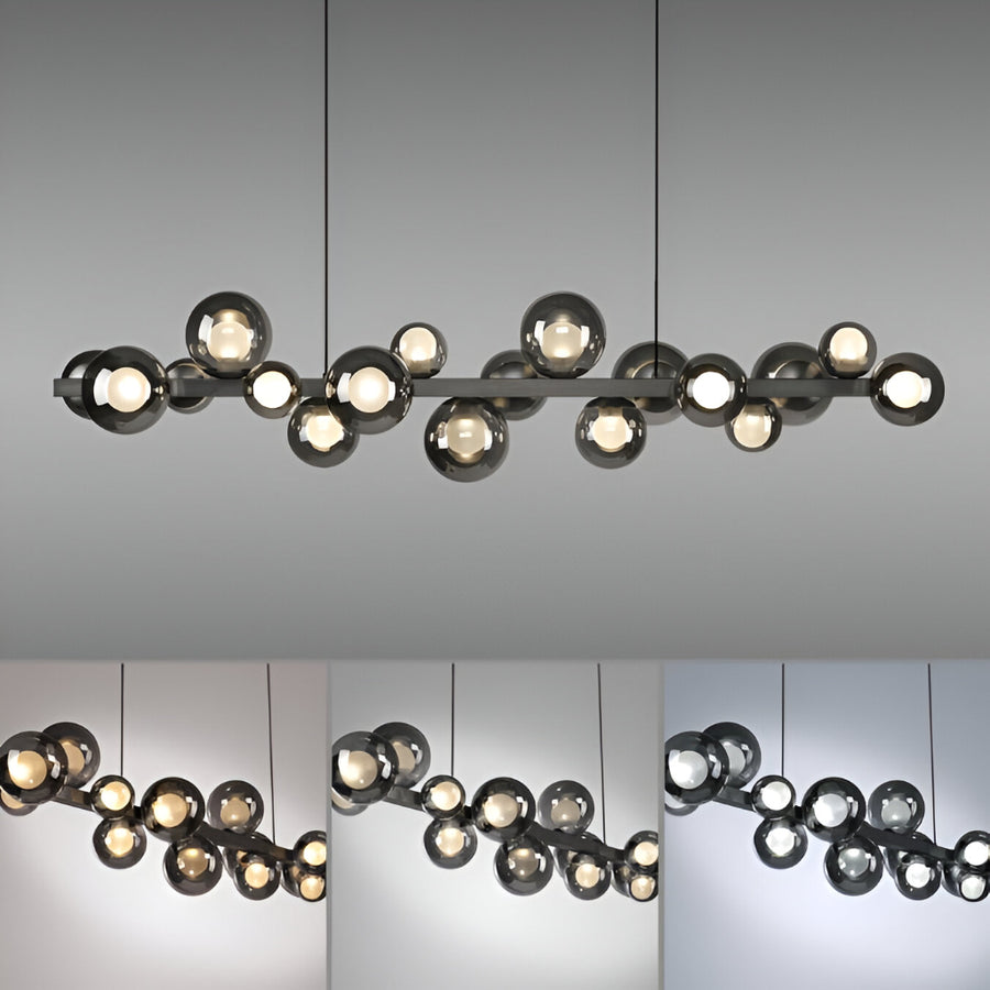 Modern Kinetic chandelier with multiple lights on a gray background showing different colour temperatures