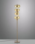 Modern floor lamp with multiple light bulbs on a gray background
