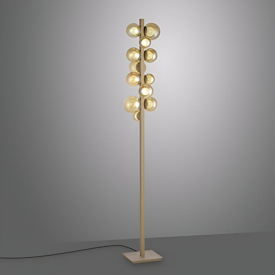 Modern floor lamp with multiple spherical lights on a gray background