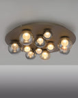 Ceiling light fixture with multiple bulbs on a gray background