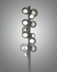 Modern floor lamp with multiple circular light fixtures on a gray background