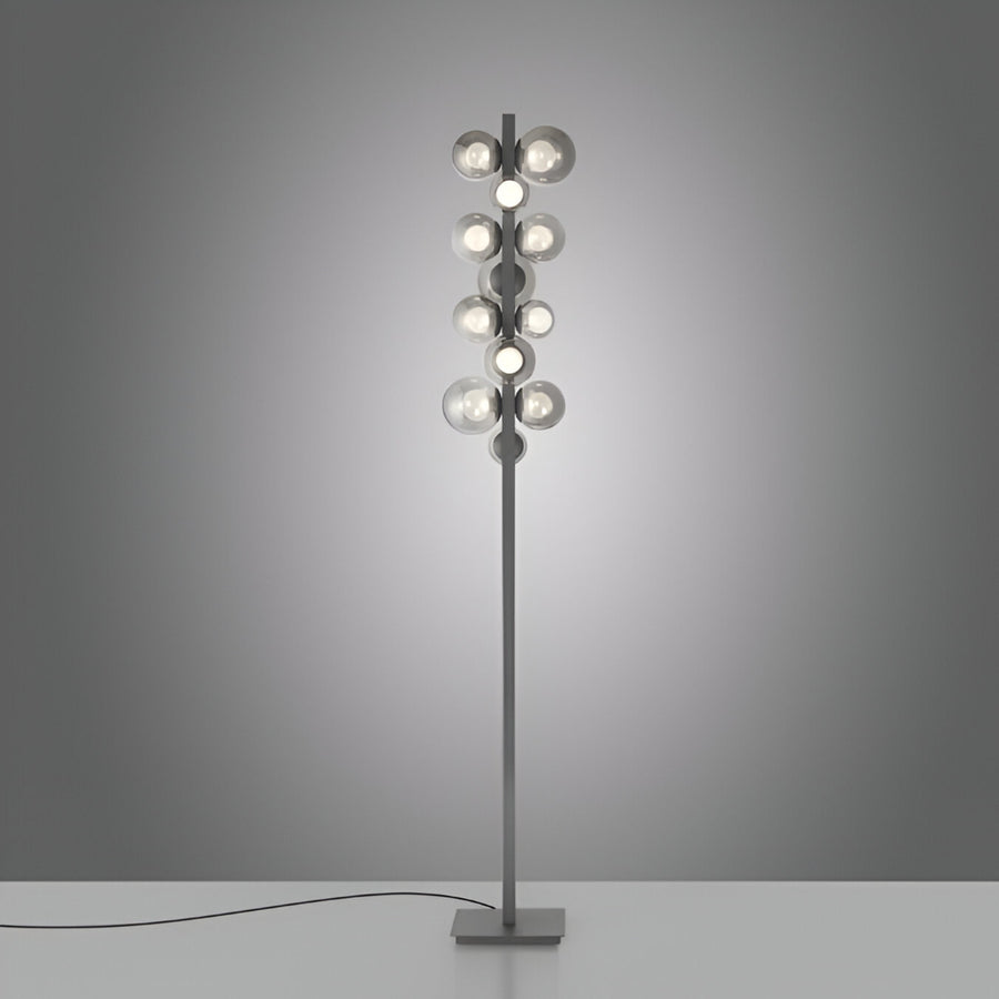 Modern floor lamp with multiple light bulbs on a gray background