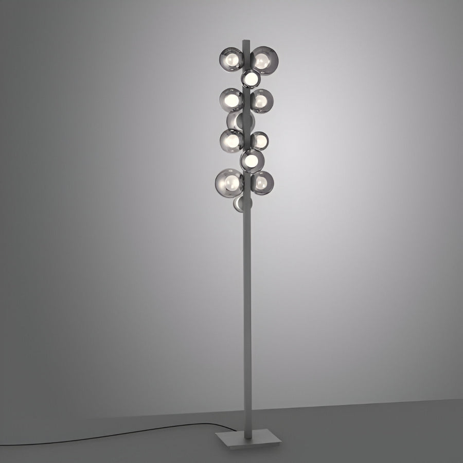 Modern floor lamp with multiple light bulbs on a gray background