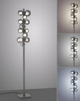 Modern floor lamp with multiple spherical lights on a gray background