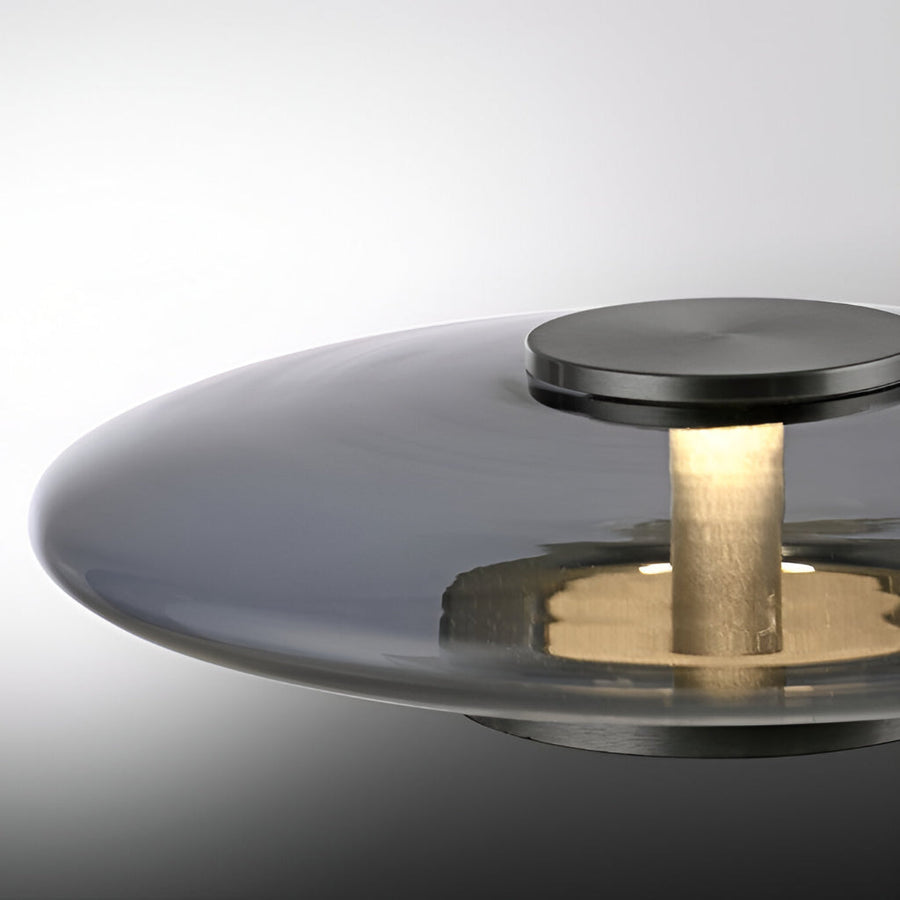 Modern table lamp with metallic finish on a gradient background