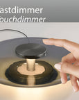Hand interacting with a touchdimmer switch on a light fixture, with text 'Tastdimmer Touchdimmer' above.