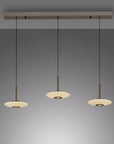 Modern pendant light fixture with three hanging lights on a gray background