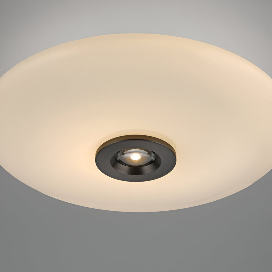Ceiling light fixture with white shade and black trim on a gray background