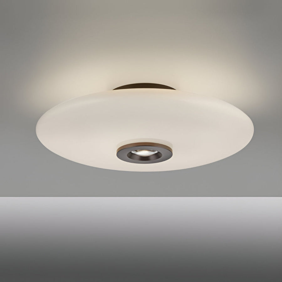 Ceiling light fixture with white shade on a gray background