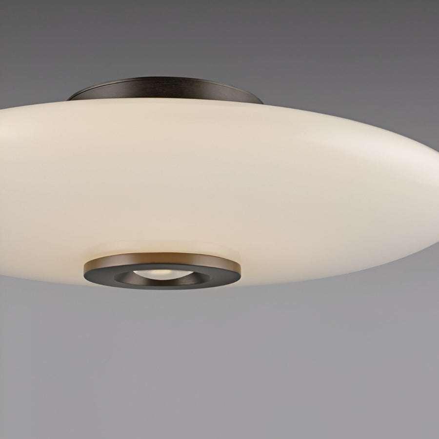 Ceiling light fixture with white glass shade and bronze metal accents on a gray background