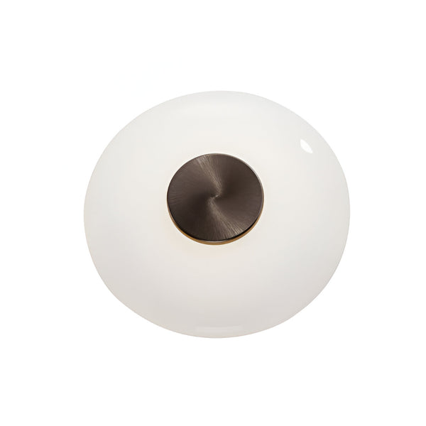 Round light fixture with white glass shade and bronze metal base on a white background