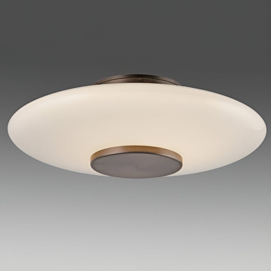 Modern ceiling light fixture with white shade and bronze base on a gray background