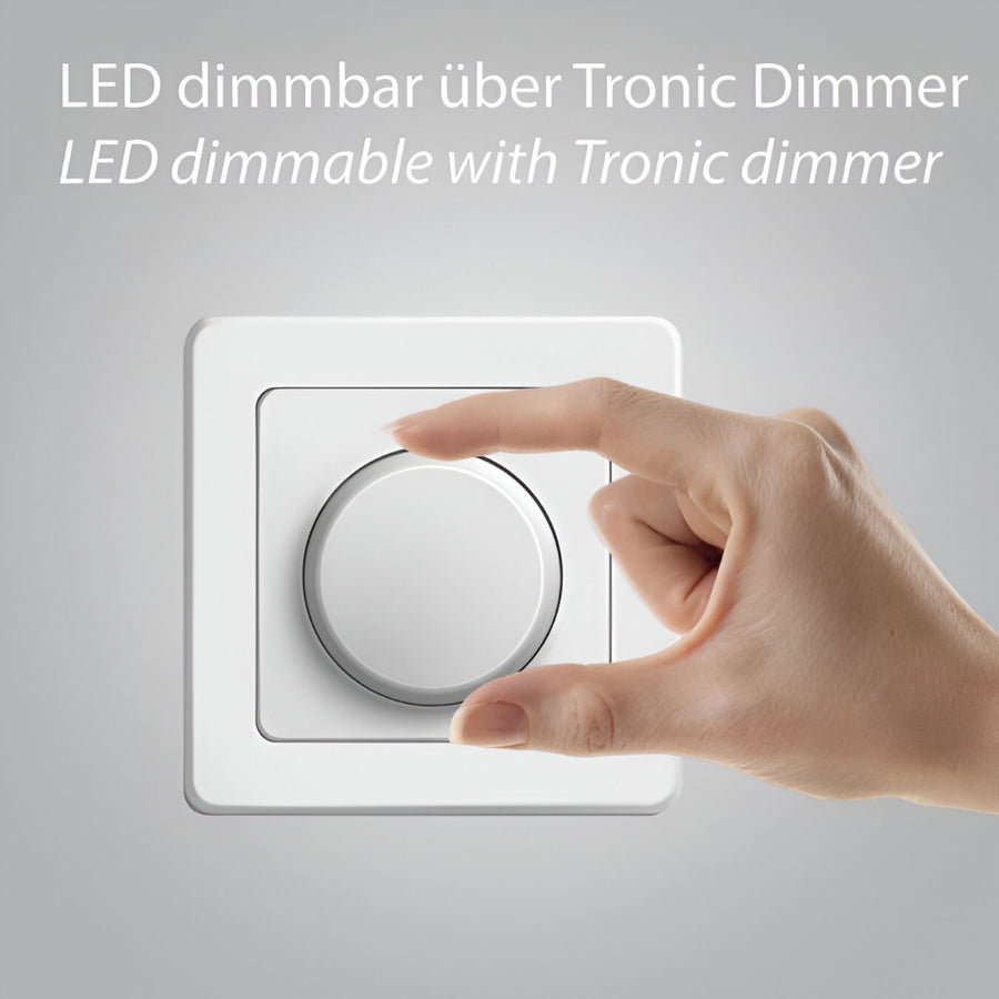Hand adjusting a Tronic dimmer switch on a gray background